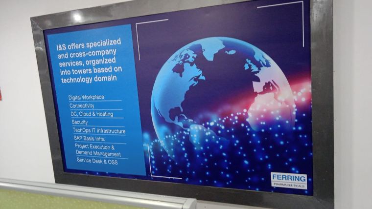 Backlit fabric light box with a printed graphic on an office wall