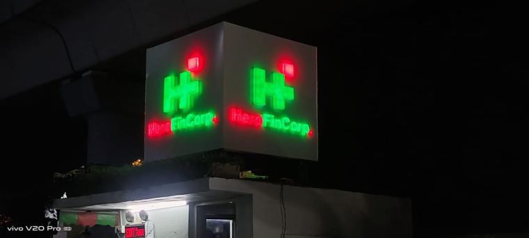 Illuminated double-sided flange sign at night – CADMAP, Delhi