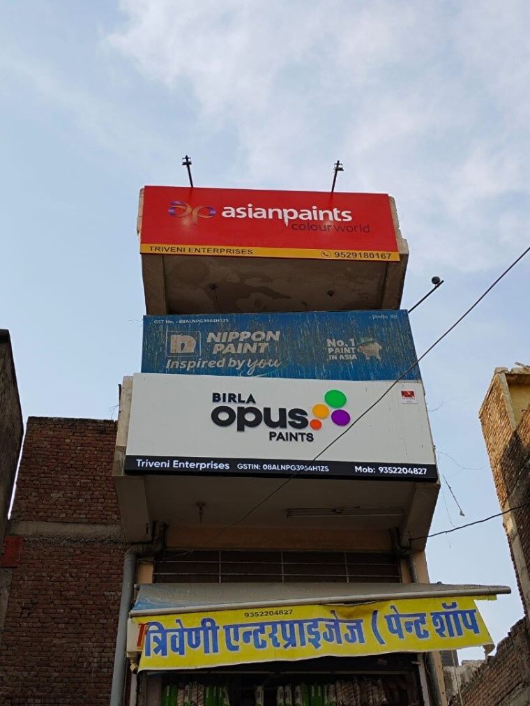 Stacked flange sign boards on a multi-storey commercial building