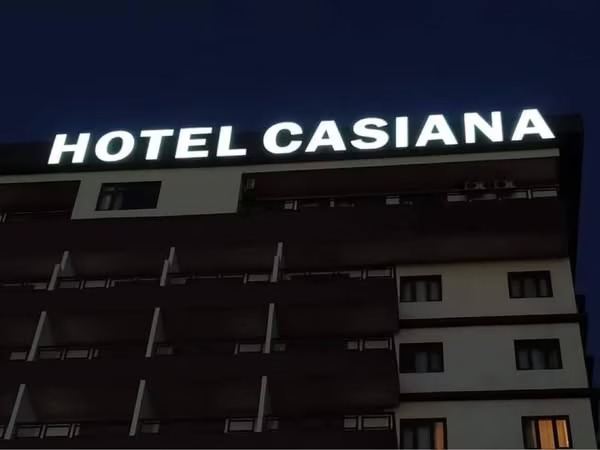 Illuminated hotel rooftop signage at night – CADMAP, Delhi