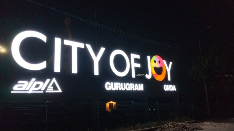 Large outdoor LED letter signage glowing at night – CADMAP, Delhi