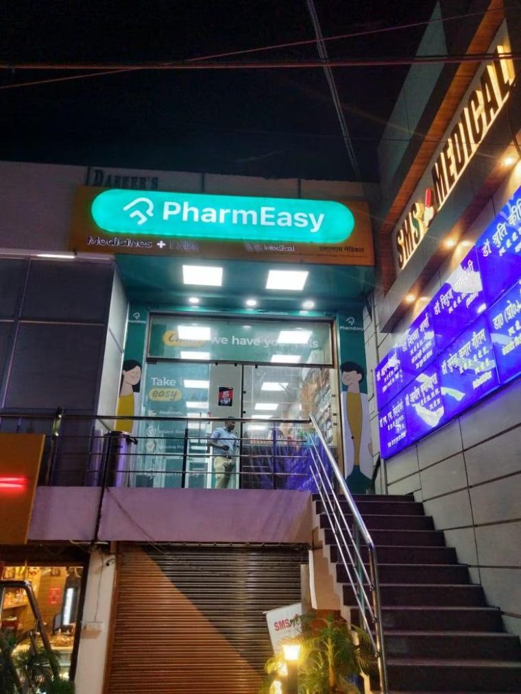 Illuminated retail storefront signage and entrance branding in Delhi