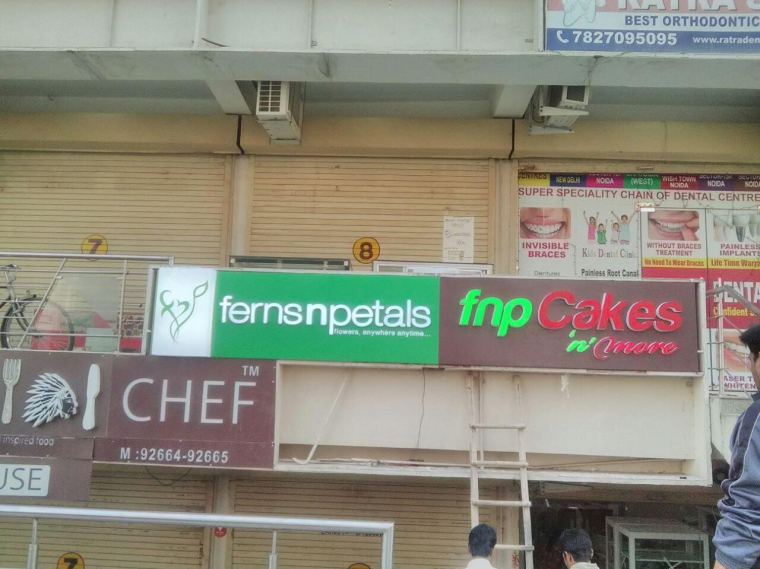 Row of retail shop signage in a market